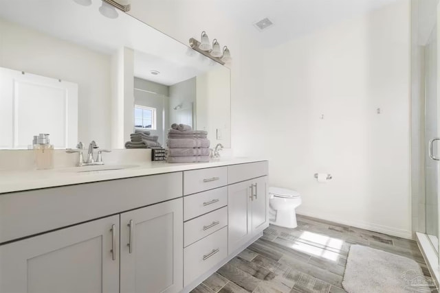14478 Salt Meadow Dr, Pensacola, FL 32507 - bathroom featuring a stall shower, double vanity, and toilet