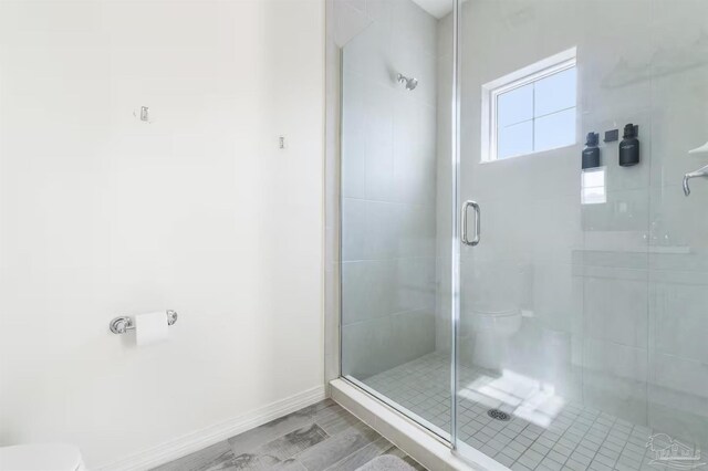 14478 Salt Meadow Dr, Pensacola, FL 32507 - bathroom featuring toilet, a shower stall, and baseboards
