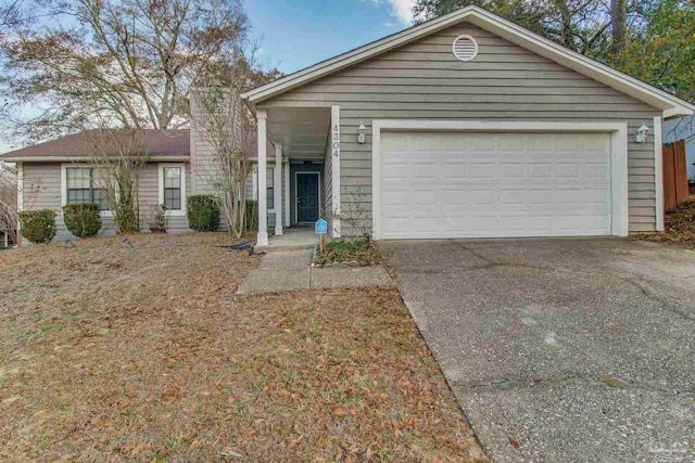 single story home featuring a garage