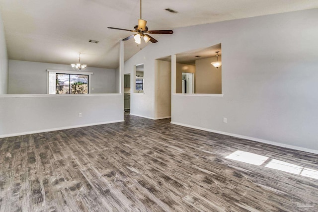 empty room featuring dark wood-type flooring, lofted ceiling, and ceiling fan with notable chandelier