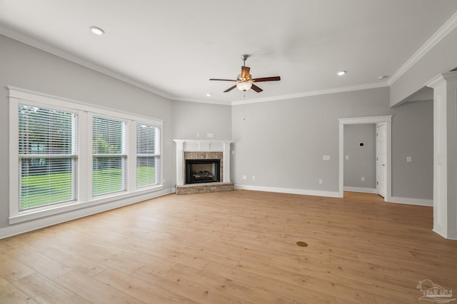6264 Howie Way, Pace, FL 32571 - unfurnished living room featuring ceiling fan, a brick fireplace, crown molding, light wood-style flooring, and recessed lighting