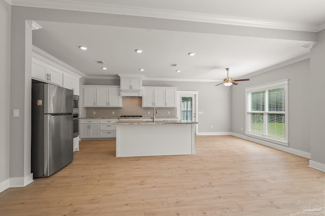 6264 Howie Way, Pace, FL 32571 - kitchen featuring appliances with stainless steel finishes, white cabinets, backsplash, light wood finished floors, and ornamental molding