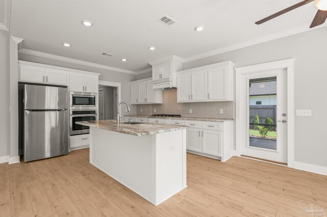 6264 Howie Way, Pace, FL 32571 - kitchen with appliances with stainless steel finishes, white cabinets, light wood-style floors, ornamental molding, and recessed lighting