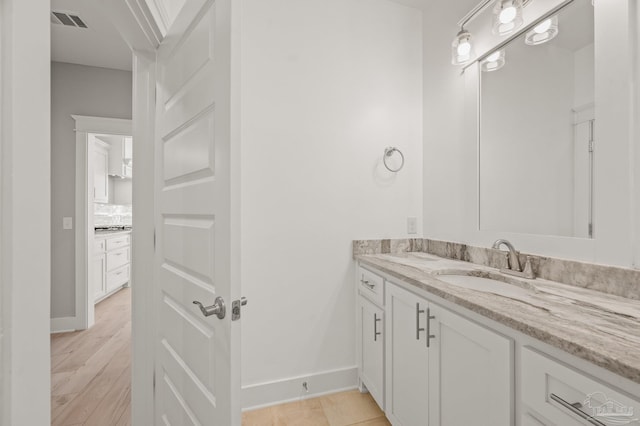 6264 Howie Way, Pace, FL 32571 - bathroom with double vanity and baseboards