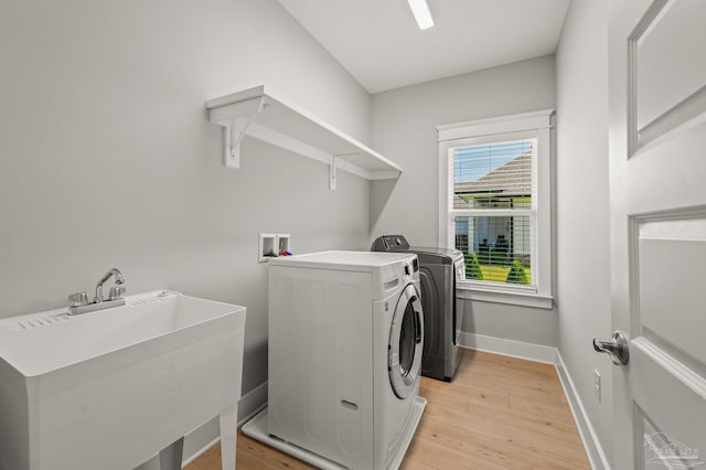 6264 Howie Way, Pace, FL 32571 - washroom featuring washing machine and dryer and light wood-style floors