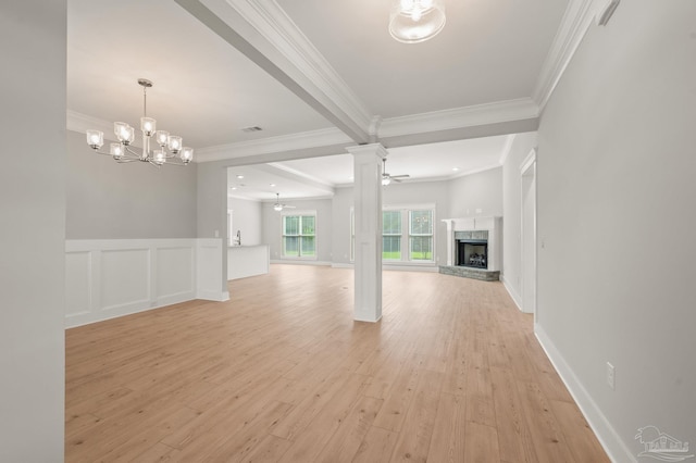 6264 Howie Way, Pace, FL 32571 - unfurnished living room with a fireplace with raised hearth, ornamental molding, light wood finished floors, a chandelier, and ornate columns