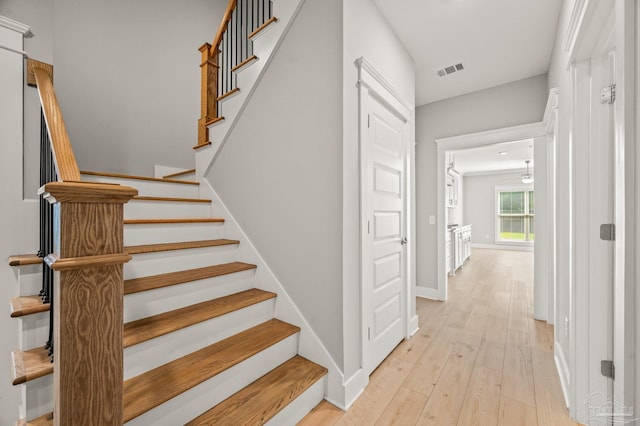 6264 Howie Way, Pace, FL 32571 - stairway with wood finished floors and baseboards