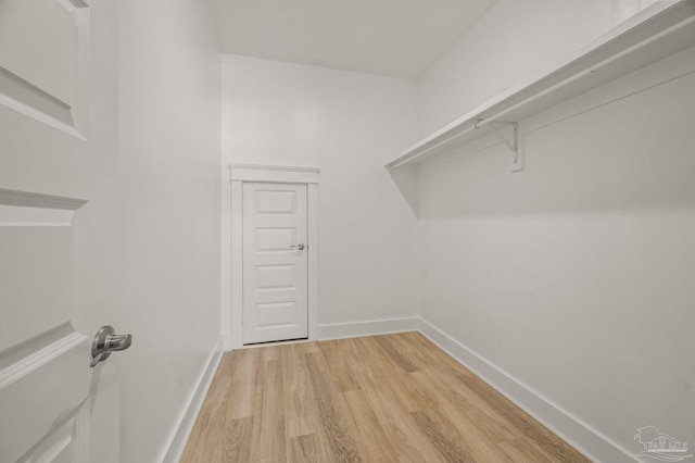 6264 Howie Way, Pace, FL 32571 - walk in closet featuring light wood finished floors