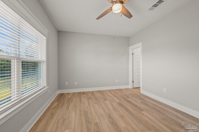 6264 Howie Way, Pace, FL 32571 - unfurnished room featuring a ceiling fan, healthy amount of natural light, and light wood-style flooring