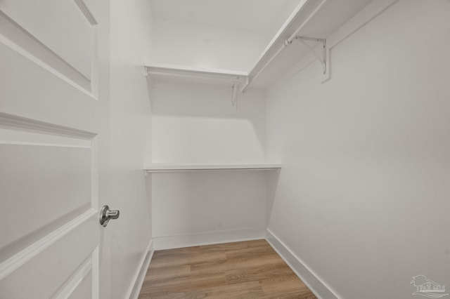 6264 Howie Way, Pace, FL 32571 - spacious closet featuring light wood-style flooring