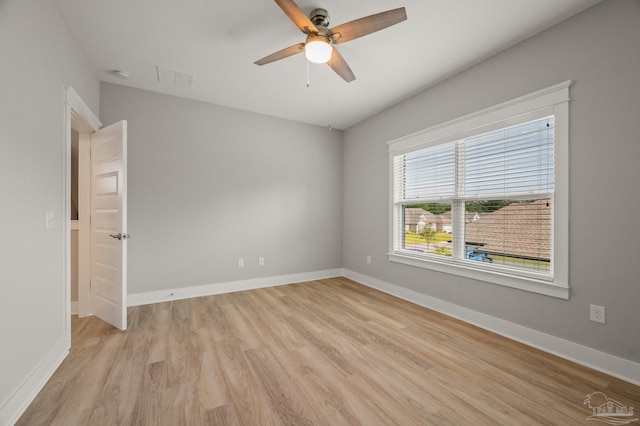 6264 Howie Way, Pace, FL 32571 - unfurnished room featuring light wood-style flooring, a ceiling fan, and a smoke detector