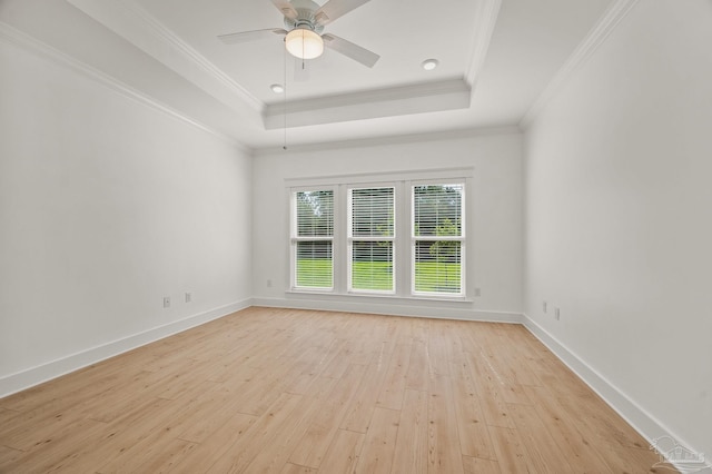 6264 Howie Way, Pace, FL 32571 - empty room with light wood finished floors, a raised ceiling, ornamental molding, and ceiling fan