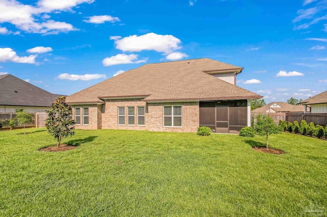 6264 Howie Way, Pace, FL 32571 - back of property featuring a fenced backyard, a sunroom, and roof with shingles
