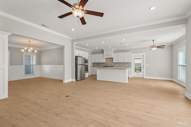 6264 Howie Way, Pace, FL 32571 - unfurnished living room featuring a ceiling fan, a chandelier, light wood-type flooring, recessed lighting, and crown molding