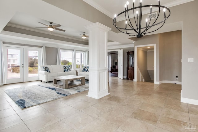 living area with visible vents, baseboards, ornamental molding, ceiling fan, and decorative columns