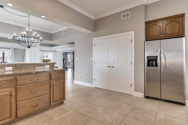 kitchen with stainless steel fridge with ice dispenser, light tile patterned floors, visible vents, and ornamental molding
