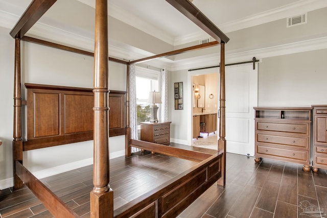 interior space with wood tiled floor, crown molding, visible vents, and a barn door