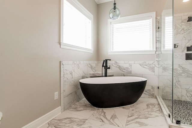 full bath featuring baseboards, a freestanding bath, tile walls, a marble finish shower, and marble finish floor