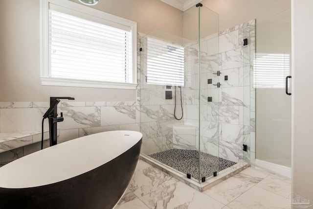 bathroom with a shower stall, marble finish floor, and a soaking tub