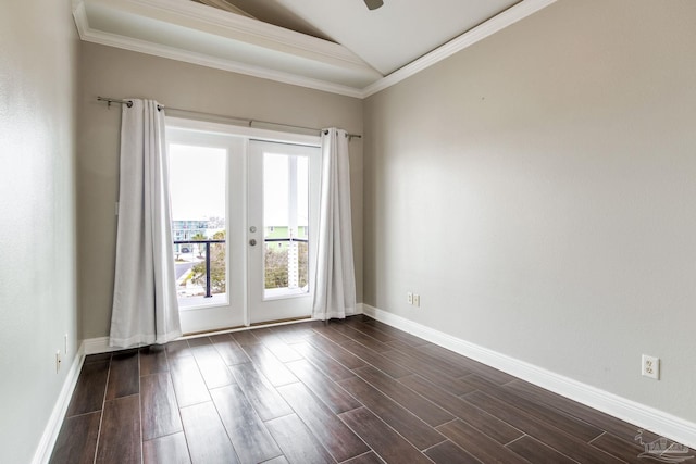 spare room with baseboards, dark wood-style floors, crown molding, vaulted ceiling, and french doors