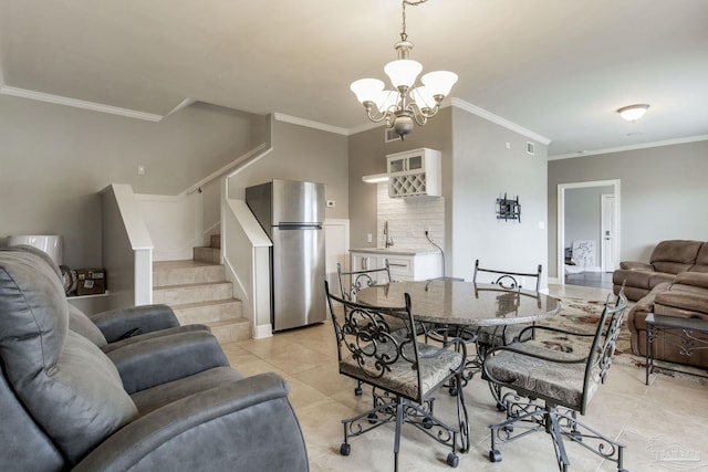 dining area with stairs, light tile patterned floors, a notable chandelier, and ornamental molding