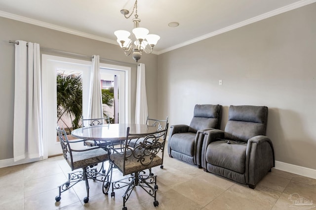 dining space with a notable chandelier, ornamental molding, and baseboards