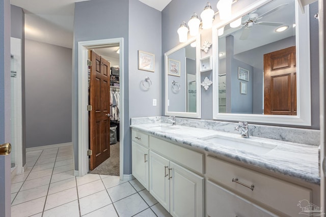2205 Valle Escondido Dr, Pensacola, FL 32526 - bathroom with a ceiling fan, a walk in closet, tile patterned flooring, double vanity, and a shower