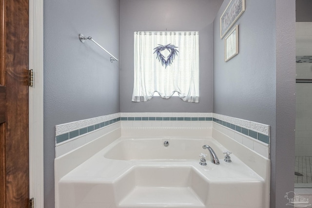 2205 Valle Escondido Dr, Pensacola, FL 32526 - full bath with plenty of natural light, a bath, and a textured wall