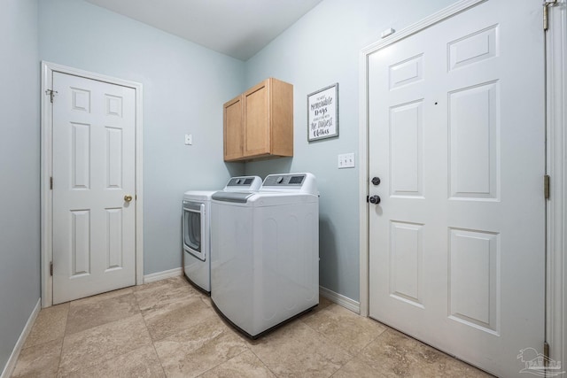 2205 Valle Escondido Dr, Pensacola, FL 32526 - laundry room featuring separate washer and dryer, baseboards, and cabinet space