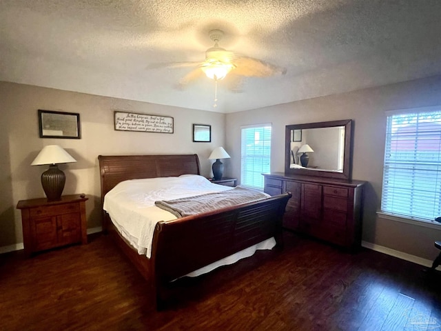 bedroom with baseboards, a textured ceiling, wood finished floors, and a ceiling fan