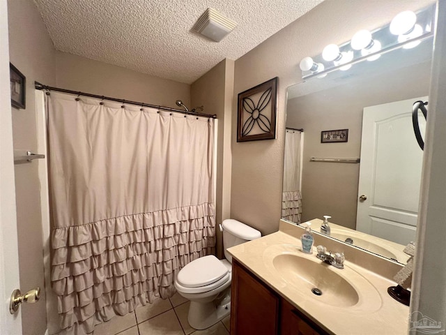 full bath featuring a textured ceiling, visible vents, toilet, vanity, and tile patterned flooring