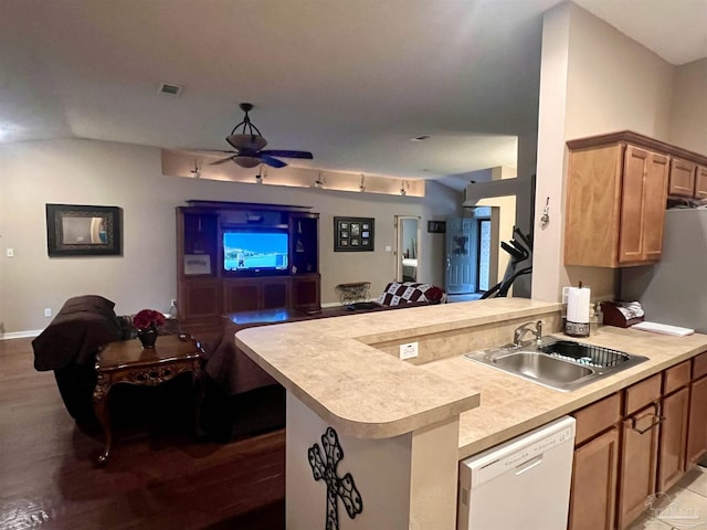 kitchen with a sink, visible vents, white dishwasher, and open floor plan
