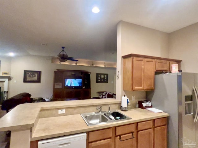 kitchen featuring light countertops, ceiling fan, a sink, open floor plan, and white dishwasher