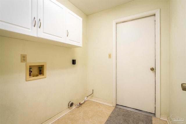 clothes washing area with hookup for a washing machine, hookup for a gas dryer, light tile patterned flooring, and cabinets