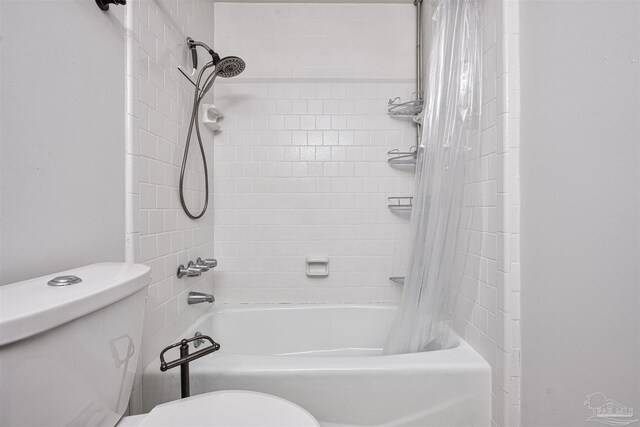 bathroom featuring tile patterned flooring, toilet, and vanity