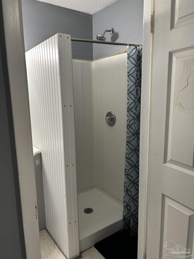 full bath featuring a stall shower