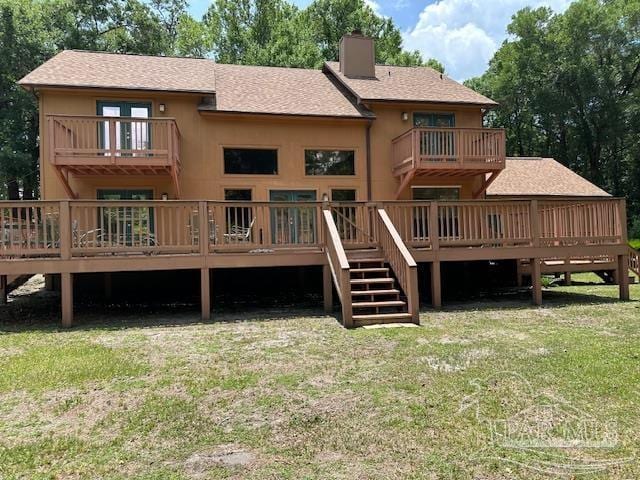 430 Citation Dr, Cantonment, FL 32533 - back of property featuring a balcony, a chimney, a lawn, and a deck