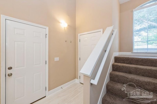 2172 Hadleigh Hills Ct, Navarre, FL 32566 - stairs featuring baseboards and wood finished floors