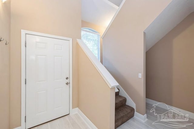 2172 Hadleigh Hills Ct, Navarre, FL 32566 - foyer featuring wood finished floors and lofted ceiling