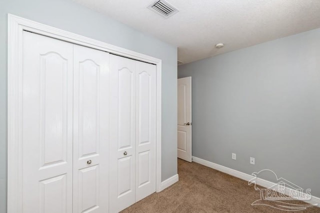 2172 Hadleigh Hills Ct, Navarre, FL 32566 - unfurnished bedroom with carpet floors and a closet