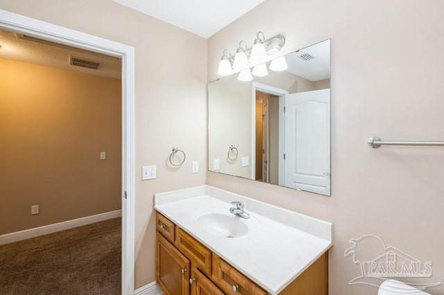 2172 Hadleigh Hills Ct, Navarre, FL 32566 - bathroom with vanity and baseboards