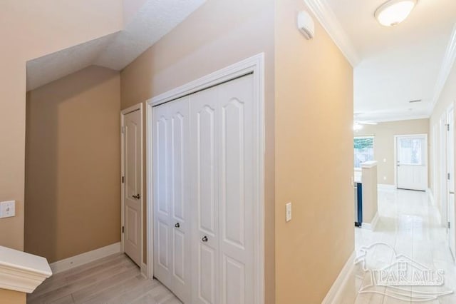 2172 Hadleigh Hills Ct, Navarre, FL 32566 - hall with light wood-type flooring and ornamental molding