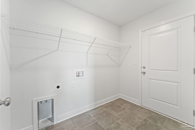 washroom featuring electric dryer hookup, tile patterned flooring, and hookup for a washing machine