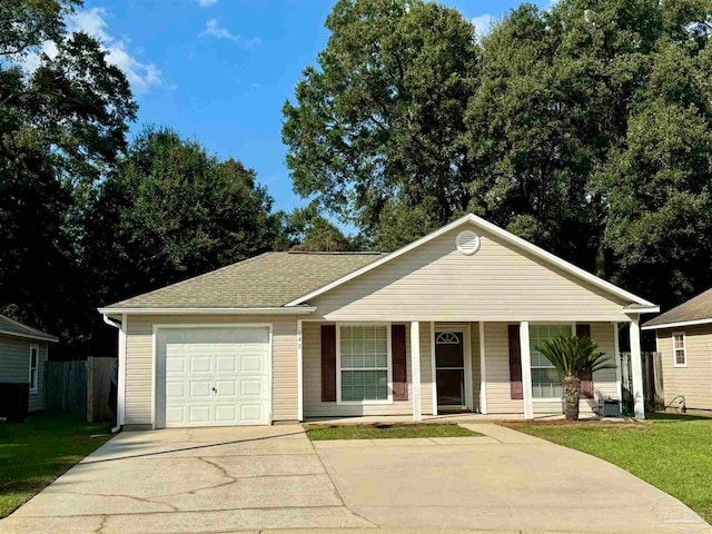 ranch-style house with a front lawn, central air condition unit, covered porch, and a garage