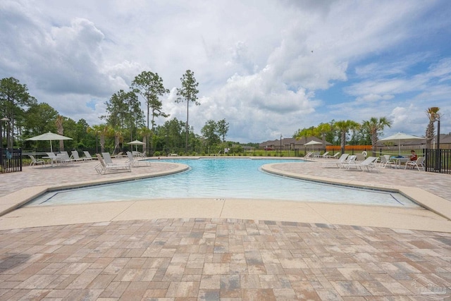 3248 Mountain Laurel Trl, Cantonment, FL 32533 - community pool featuring a patio area