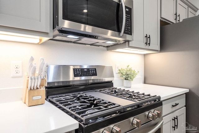 3248 Mountain Laurel Trl, Cantonment, FL 32533 - kitchen featuring stainless steel appliances, light countertops, and gray cabinets