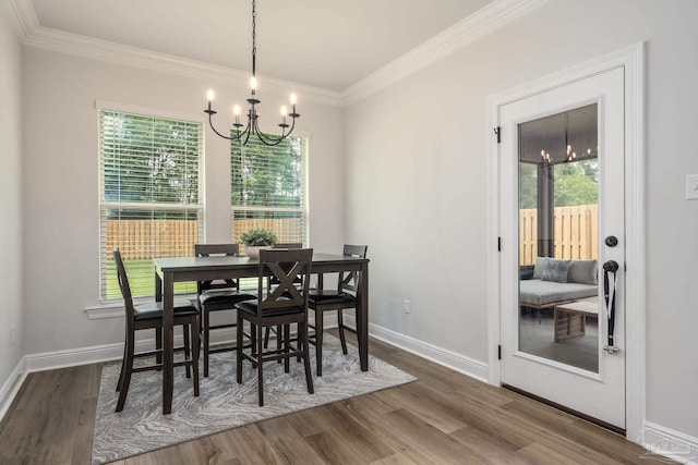3248 Mountain Laurel Trl, Cantonment, FL 32533 - dining space with a chandelier, wood finished floors, and crown molding