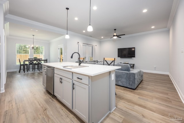 3248 Mountain Laurel Trl, Cantonment, FL 32533 - kitchen featuring stainless steel dishwasher, light countertops, an island with sink, light wood-style flooring, and a ceiling fan