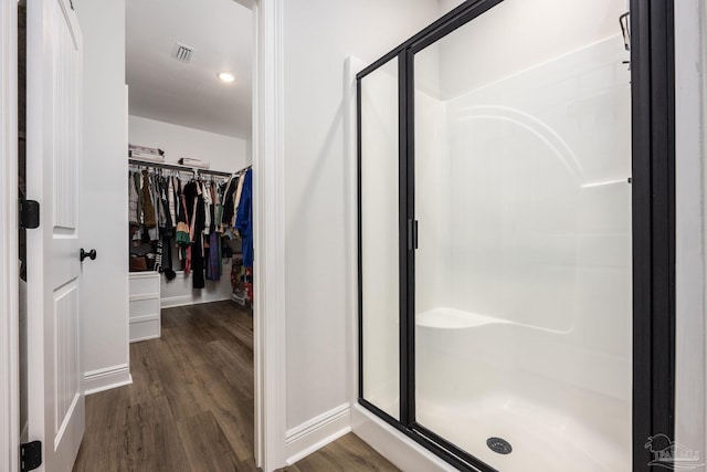 3248 Mountain Laurel Trl, Cantonment, FL 32533 - full bathroom featuring a stall shower, wood finished floors, and a spacious closet