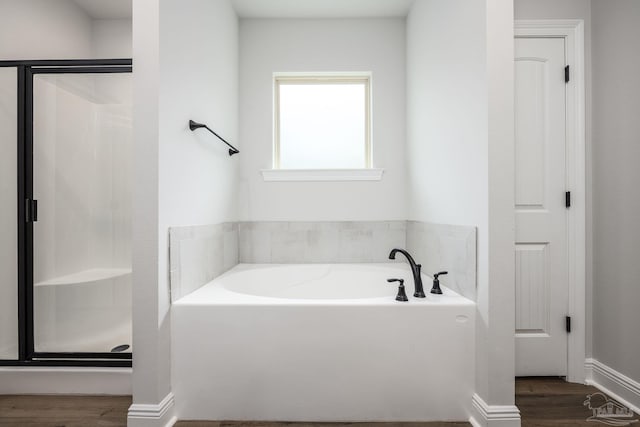3248 Mountain Laurel Trl, Cantonment, FL 32533 - bathroom with a bath, wood finished floors, and a shower stall